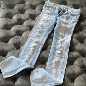 Distressed light denim jeans